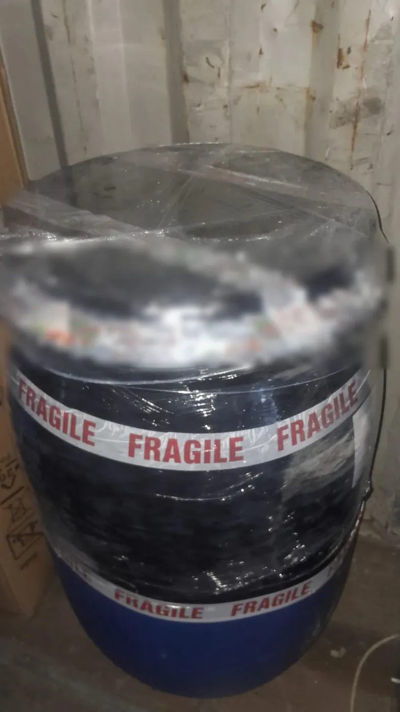Packed barrel wrapped and sealed with fragile tape, ready to ship