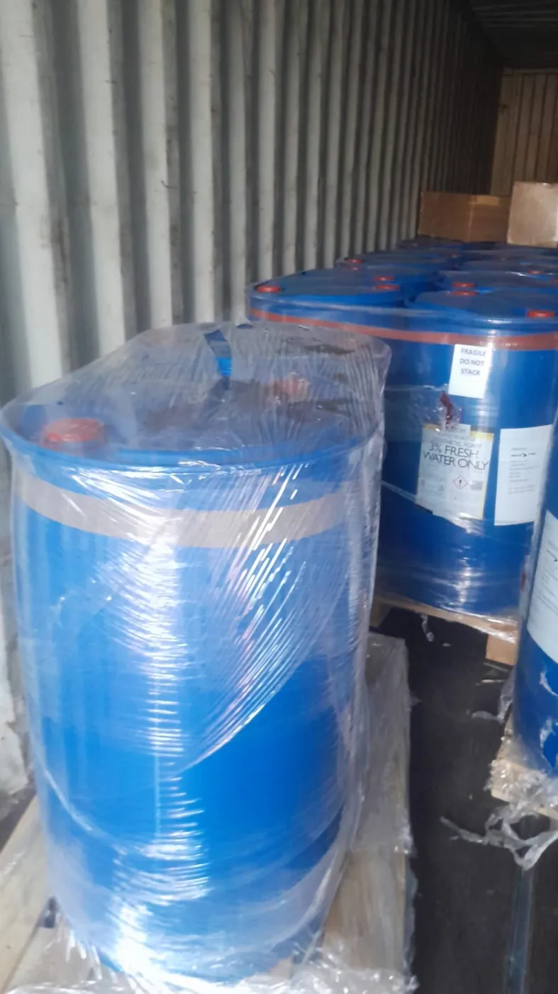 Palletised cargo shrink-wrapped and secured inside a shipping container